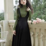 Dark-Academia-Women-in-Green-Sweater-Black-Suspender-Dress-Outfit (2)